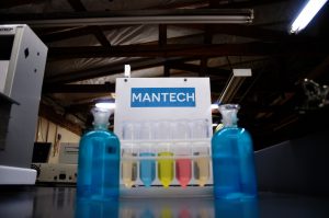 Mantech logo (clear) with test tubes